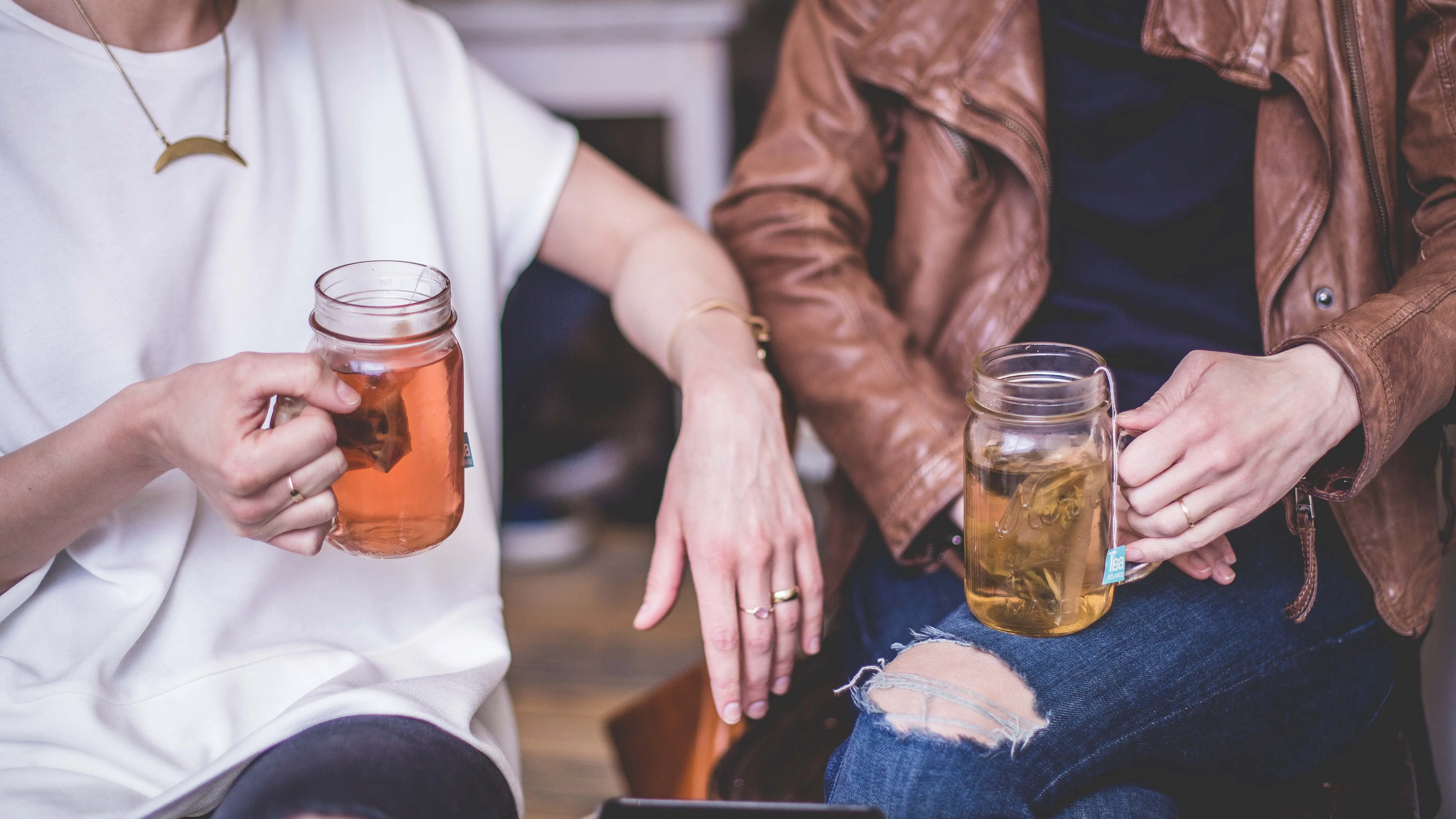 Two people with tea sitting